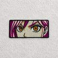 Anime Eyes embroidered patch displayed on a light grey felt background.
