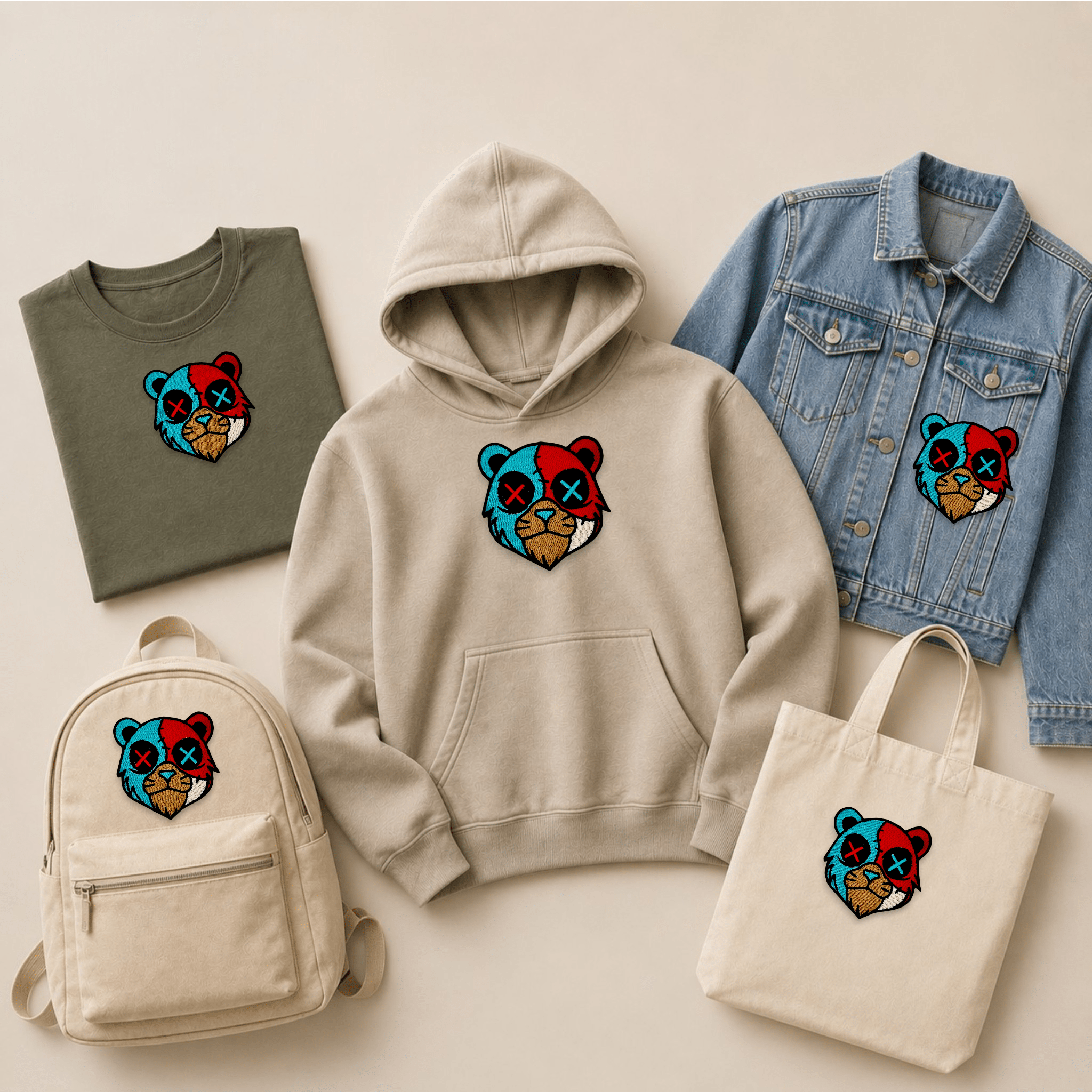 Colourful bear head embroidered patch displayed on a hoodie, T-shirt, denim jacket, backpack and tote bag, showcasing a custom embroidered bear patch across clothing and everyday accessories.