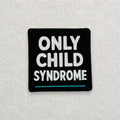 Only Child Syndrome embroidered morale patch displayed on a light grey felt background.